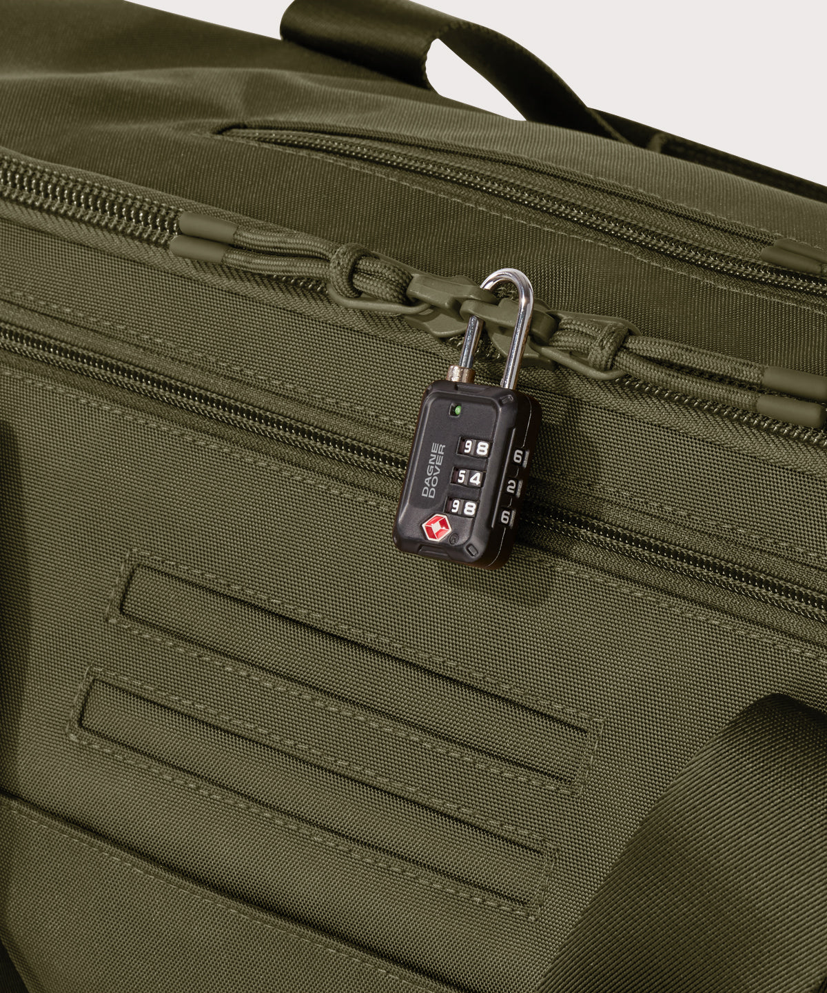 Detail shot of Monaco garment duffle in dark green lockable zipper heads. Lock not included.

