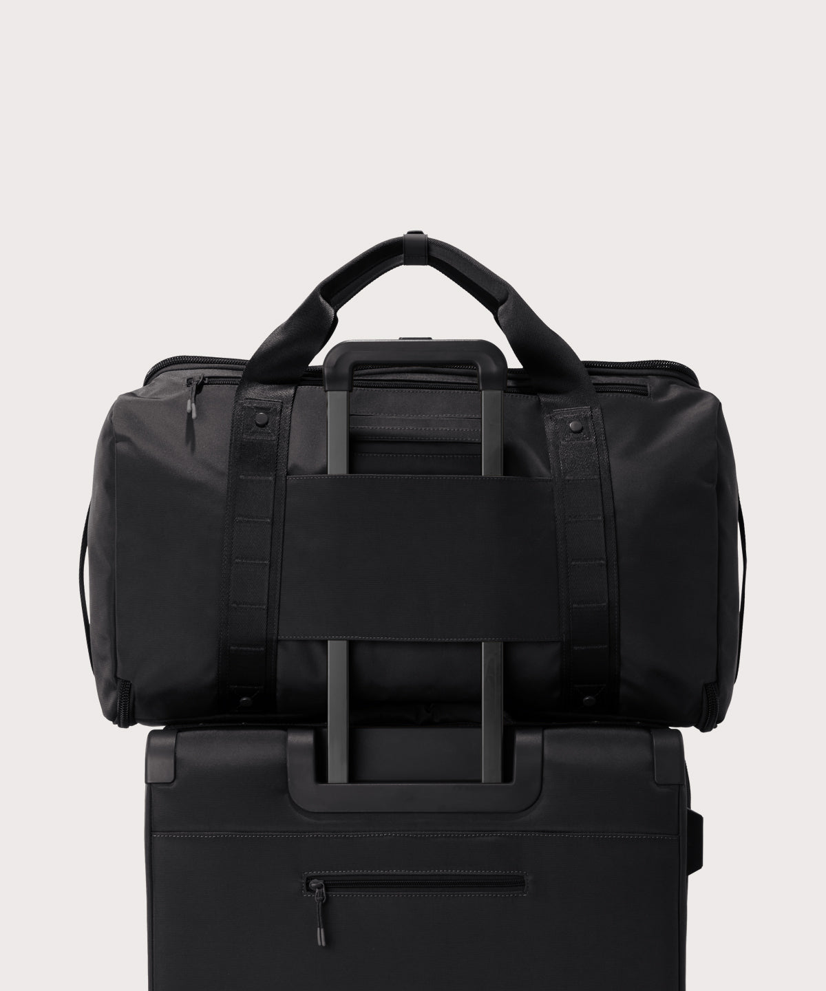 Back view of Monaco garment duffle in black on luggage handle