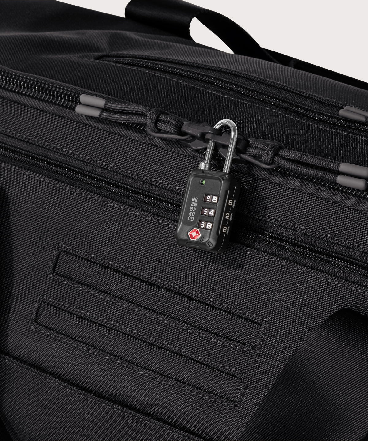 Detail shot of Monaco garment duffle in black lockable zipper heads. Lock not included.
