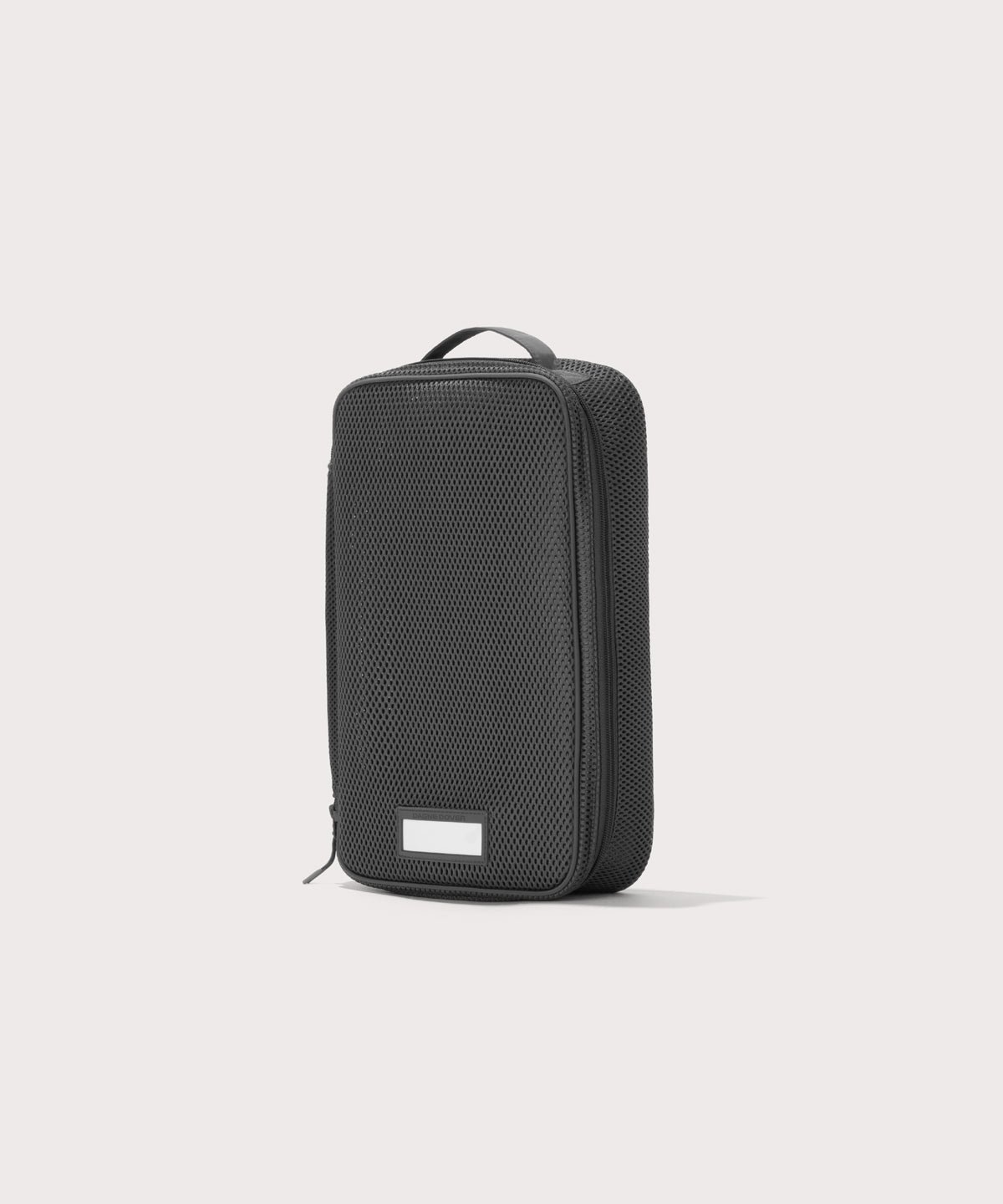 3/4 view of medium Roma packing cube in carbon black
