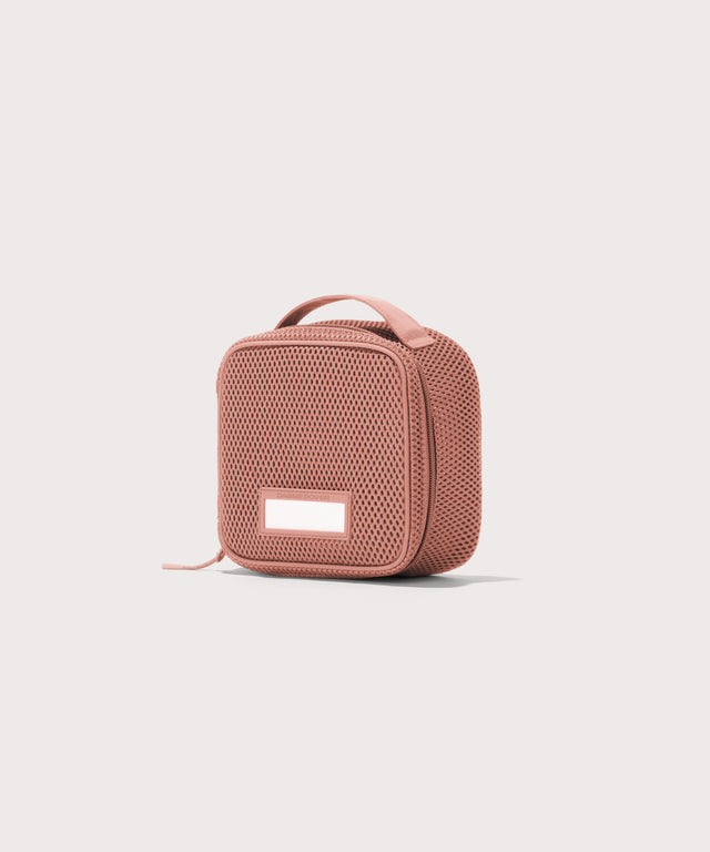 3/4 view of small Roma packing cube in warm dust pink
