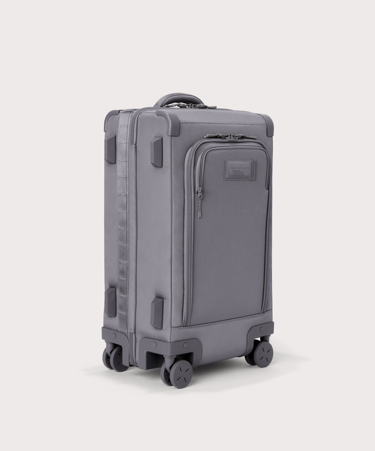 3/4 front view of Seattle carry-on rolling luggage 20.5” in light grey showing side luggage feet
