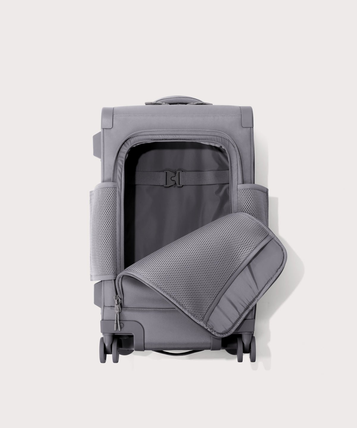 Top down of Seattle carry-on rolling luggage 20.5” in light grey with front flap opened. 
