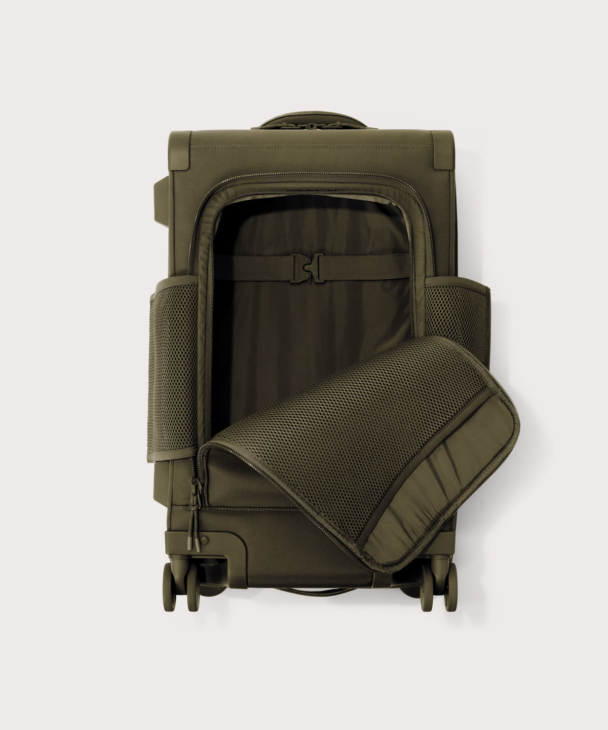 Top down of Seattle carry-on rolling luggage 23.5” in dark moss with front flap opened. 
