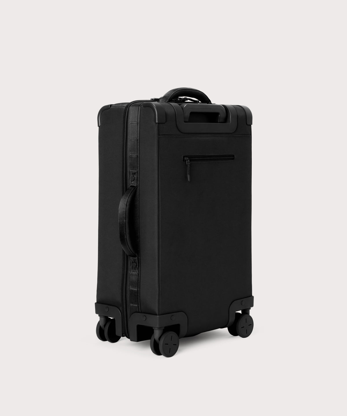 3/4 back view of Seattle carry-on rolling luggage 23.5” in onyx showing side handle and back zippered phone/passport pocket
