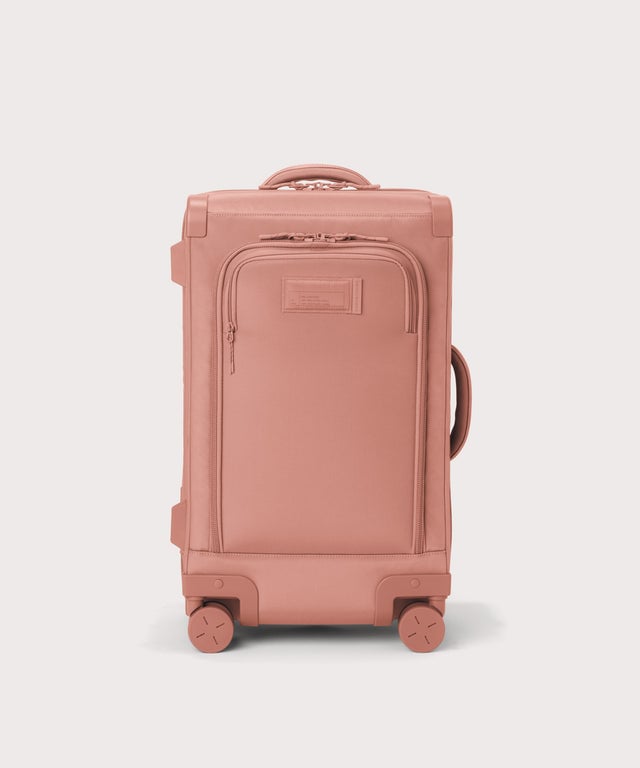 Front view of Seattle carry-on rolling luggage 20.5” in warm dust pink

