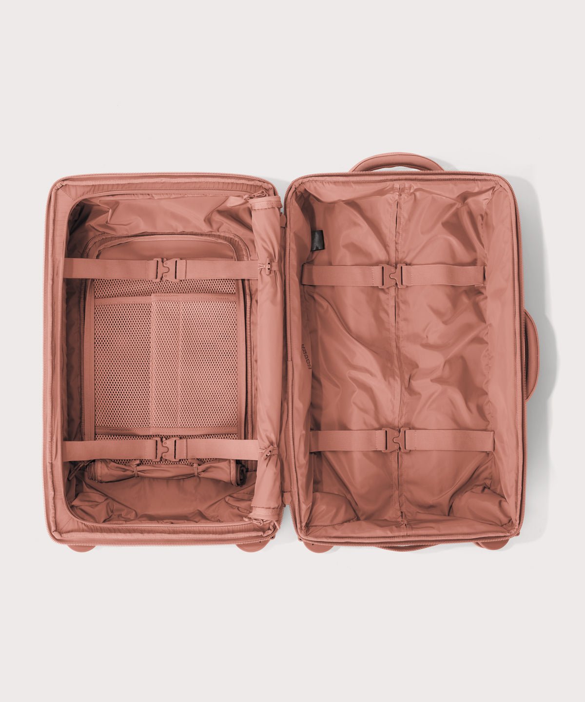 Top down of Seattle carry-on rolling luggage 20.5” in warm dust pink 
