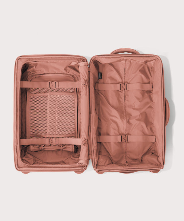 Top down of Seattle carry-on rolling luggage 20.5” in warm dust pink 
