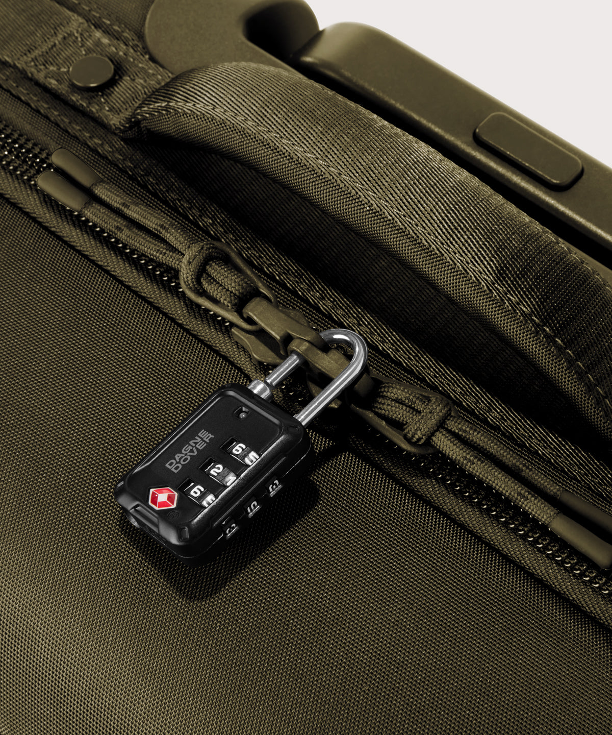 Detail shot of Sydney checked rolling luggage 28.5” in dark green lockable zipper heads. Lock not included. 
