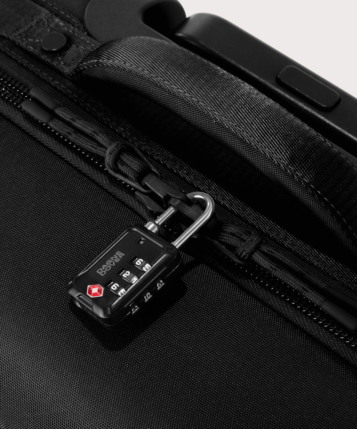 Detail shot of Seattle carry-on rolling luggage 23.5” in onyx lockable zipper heads. Lock not included.
