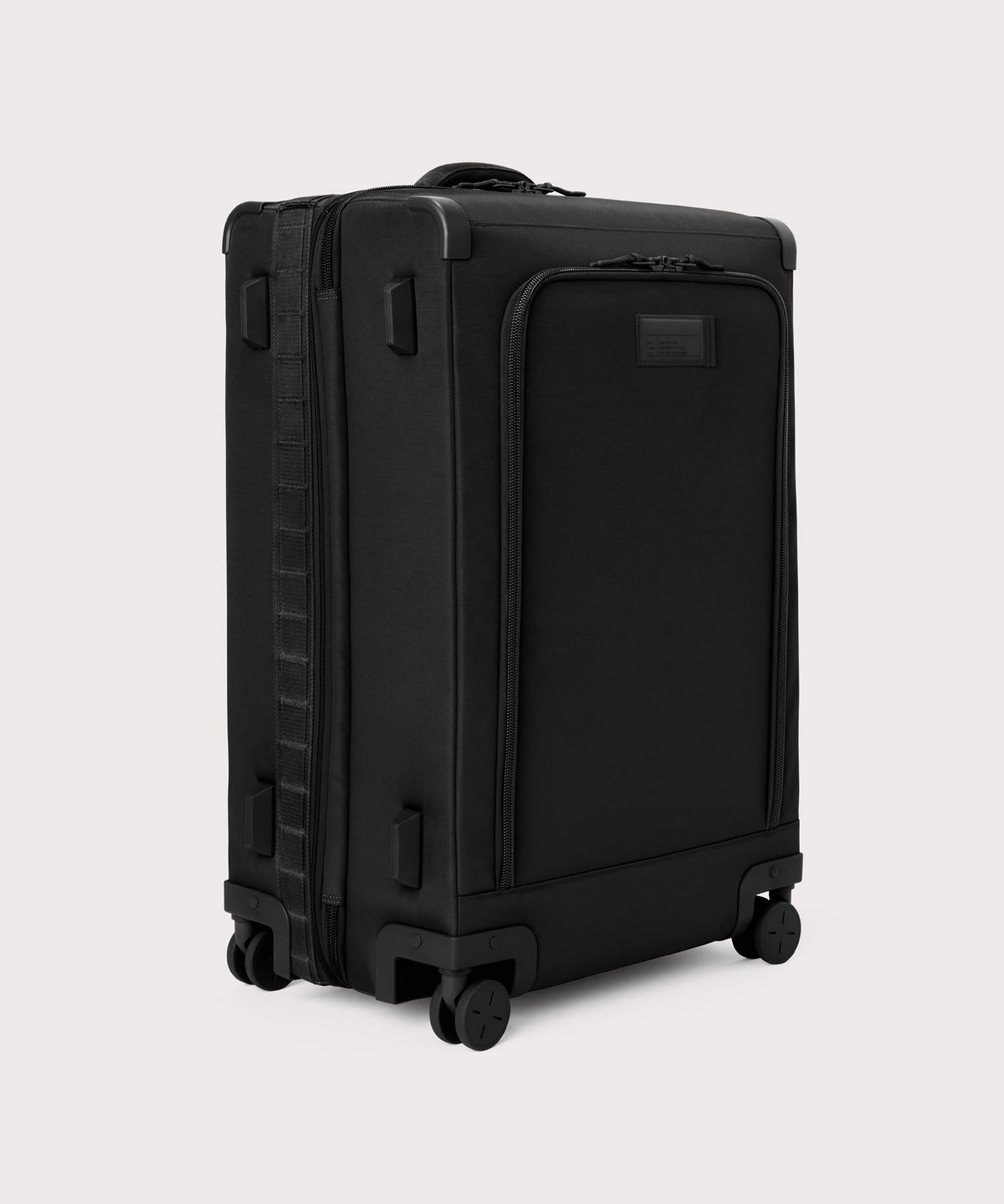 3/4 front view of Sydney checked rolling luggage 28.5” in onyx showing side luggage feet
