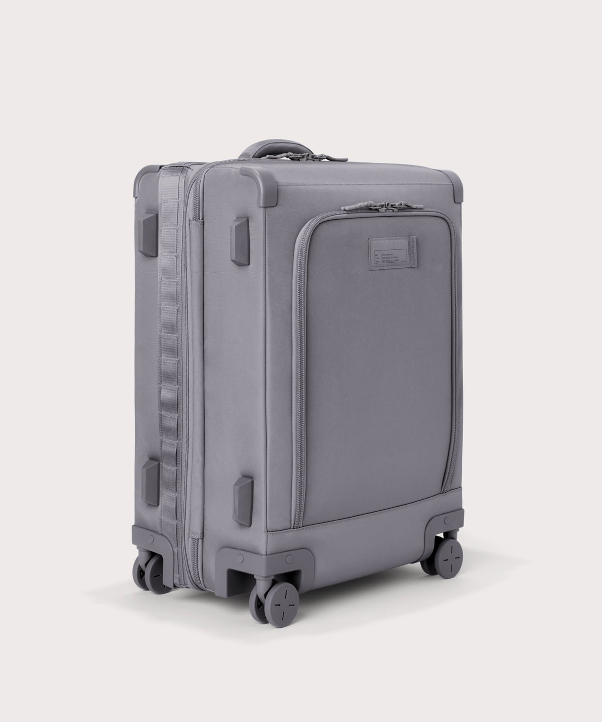 3/4 front view of Sydney checked rolling luggage 25" in light grey showing side luggage feet
