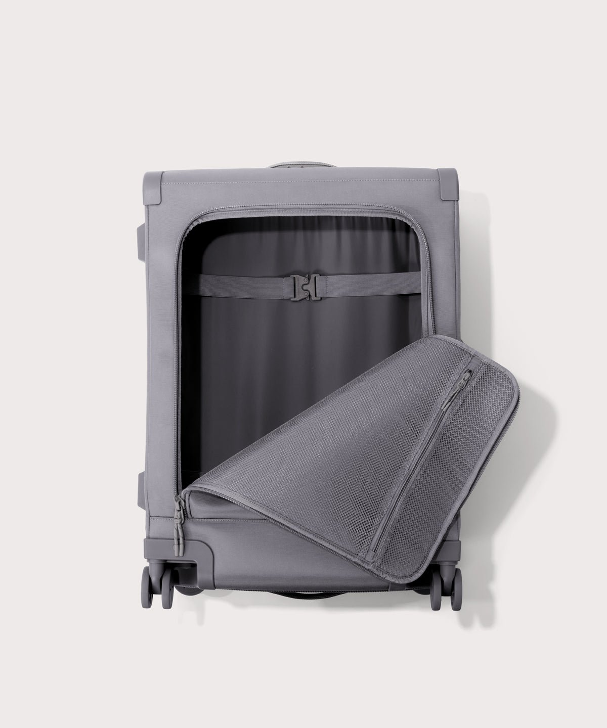Front view of Sydney checked rolling luggage 25" in light grey with front flap opened

