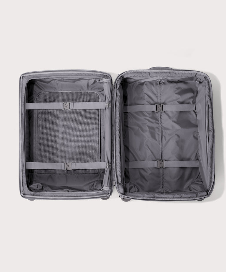 Top down of Sydney checked rolling luggage 25" in light grey 
