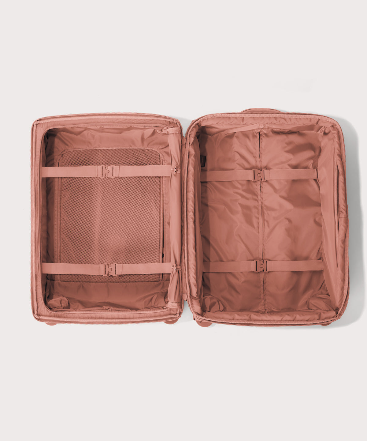 Top down of Sydney checked rolling luggage 25" in warm dust pink 
