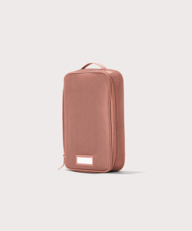 3/4 view of medium Roma packing cube in warm dust pink

